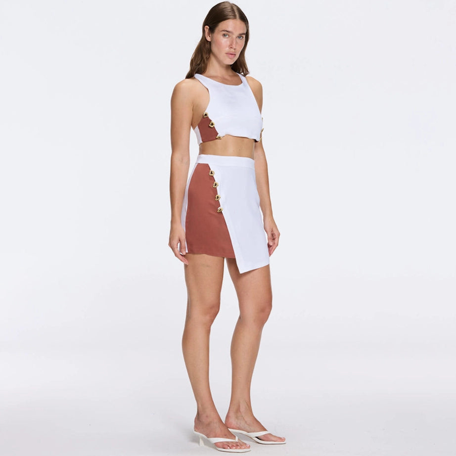 Bodrum Crop Top And Riviera White-Brown Asymmetric Mini Skort Set | Moeva | RTW Bustiers | Each week unveils new pieces—luxury swimwear, fluid resort silhouettes, and elevated summer-to-evening essentials designed to carry you from coastal escapes to city nights.