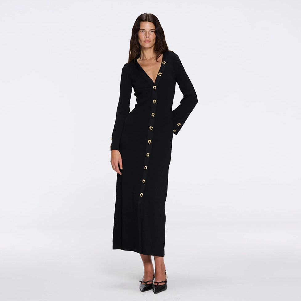 Brezia Black Knitted Maxi Dress with Long Sleeves and Gold Button Details | Moeva | RTW Dresses | Each week unveils new pieces—luxury swimwear, fluid resort silhouettes, and elevated summer-to-evening essentials designed to carry you from coastal escapes to city nights.