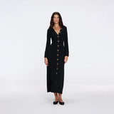 Brezia Black Knitted Maxi Dress with Long Sleeves and Gold Button Details | Moeva | RTW Dresses | Each week unveils new pieces—luxury swimwear, fluid resort silhouettes, and elevated summer-to-evening essentials designed to carry you from coastal escapes to city nights.