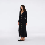 Brezia Black Knitted Maxi Dress with Long Sleeves and Gold Button Details | Moeva | RTW Dresses | Each week unveils new pieces—luxury swimwear, fluid resort silhouettes, and elevated summer-to-evening essentials designed to carry you from coastal escapes to city nights.