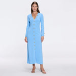 Brezia Blue Knitted Maxi Dress with Long Sleeves and Gold Button Details | Moeva | RTW Dresses | Each week unveils new pieces—luxury swimwear, fluid resort silhouettes, and elevated summer-to-evening essentials designed to carry you from coastal escapes to city nights.