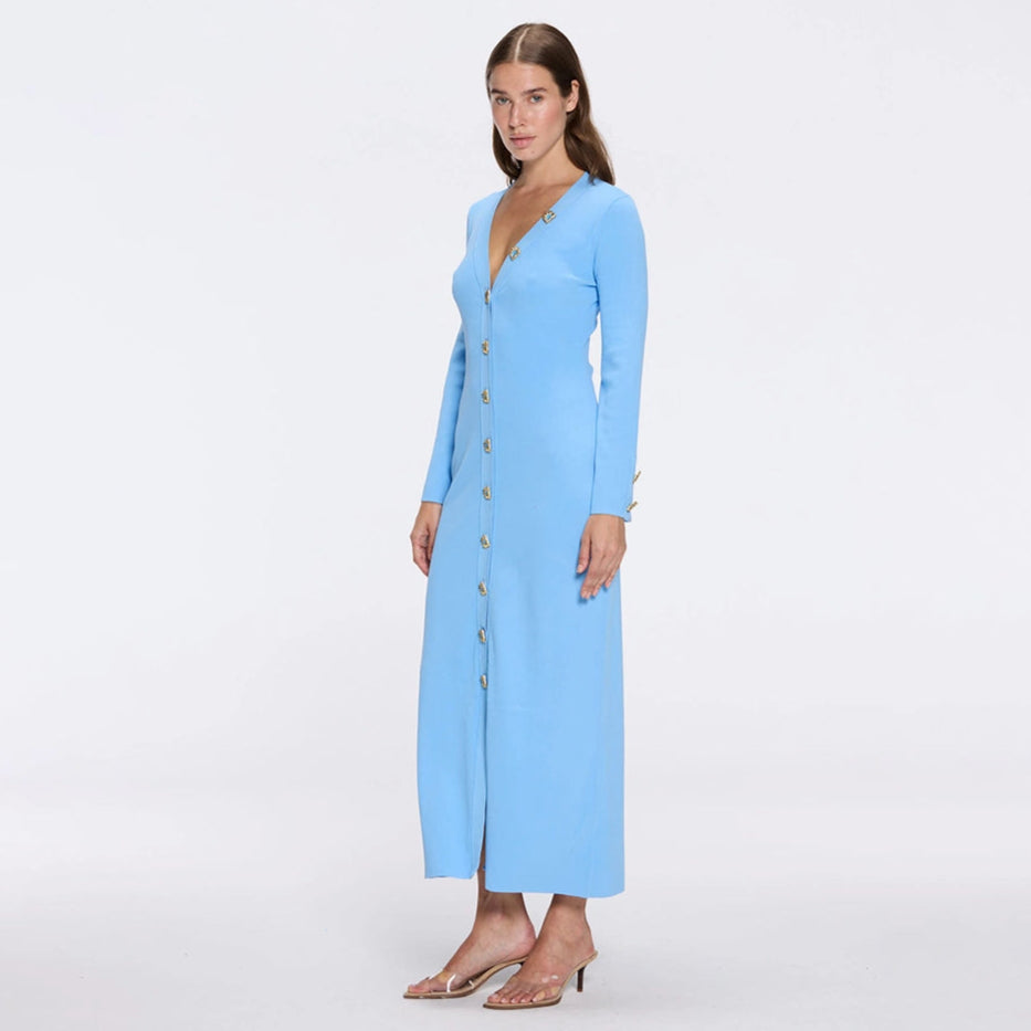 Brezia Blue Knitted Maxi Dress with Long Sleeves and Gold Button Details | Moeva | RTW Dresses | Each week unveils new pieces—luxury swimwear, fluid resort silhouettes, and elevated summer-to-evening essentials designed to carry you from coastal escapes to city nights.