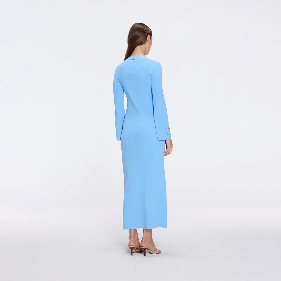 Brezia Blue Knitted Maxi Dress with Long Sleeves and Gold Button Details | Moeva | RTW Dresses | Each week unveils new pieces—luxury swimwear, fluid resort silhouettes, and elevated summer-to-evening essentials designed to carry you from coastal escapes to city nights.