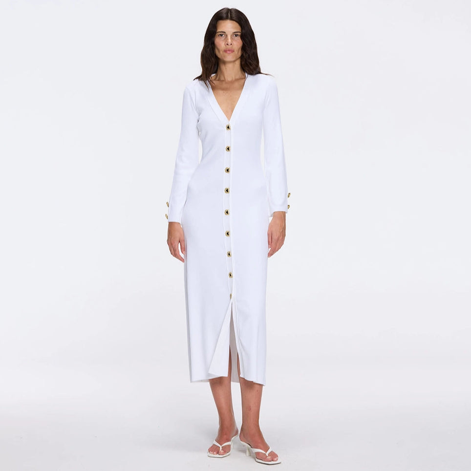 Brezia White Knitted Maxi Dress with Long Sleeves and Gold Button Details | Moeva | RTW Dresses | Each week unveils new pieces—luxury swimwear, fluid resort silhouettes, and elevated summer-to-evening essentials designed to carry you from coastal escapes to city nights.