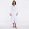 Brezia White Knitted Maxi Dress with Long Sleeves and Gold Button Details | Moeva | RTW Dresses | Each week unveils new pieces—luxury swimwear, fluid resort silhouettes, and elevated summer-to-evening essentials designed to carry you from coastal escapes to city nights.