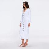 Brezia White Knitted Maxi Dress with Long Sleeves and Gold Button Details | Moeva | RTW Dresses | Each week unveils new pieces—luxury swimwear, fluid resort silhouettes, and elevated summer-to-evening essentials designed to carry you from coastal escapes to city nights.