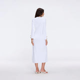 Brezia White Knitted Maxi Dress with Long Sleeves and Gold Button Details | Moeva | RTW Dresses | Each week unveils new pieces—luxury swimwear, fluid resort silhouettes, and elevated summer-to-evening essentials designed to carry you from coastal escapes to city nights.