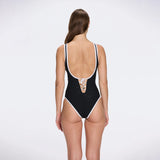 Brie V Neck Button Detail Black Swimsuit | Moeva | Swimsuit | Each week unveils new pieces—luxury swimwear, fluid resort silhouettes, and elevated summer-to-evening essentials designed to carry you from coastal escapes to city nights.