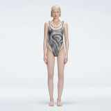Calista Black Plunge Scoop Neck Swimsuit | Moeva | One-Piece | Each week unveils new pieces—luxury swimwear, fluid resort silhouettes, and elevated summer-to-evening essentials designed to carry you from coastal escapes to city nights.