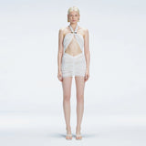 Carolina White Cut-Out Halter Swimdress | Moeva | One-Piece | Each week unveils new pieces—luxury swimwear, fluid resort silhouettes, and elevated summer-to-evening essentials designed to carry you from coastal escapes to city nights.
