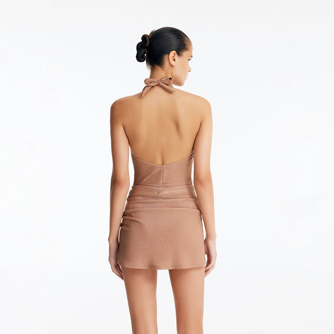 Clementine Bronze Halterneck Swimsuit with Tie-Front Skirt Detail | Moeva | Swimsuit | Each week unveils new pieces—luxury swimwear, fluid resort silhouettes, and elevated summer-to-evening essentials designed to carry you from coastal escapes to city nights.