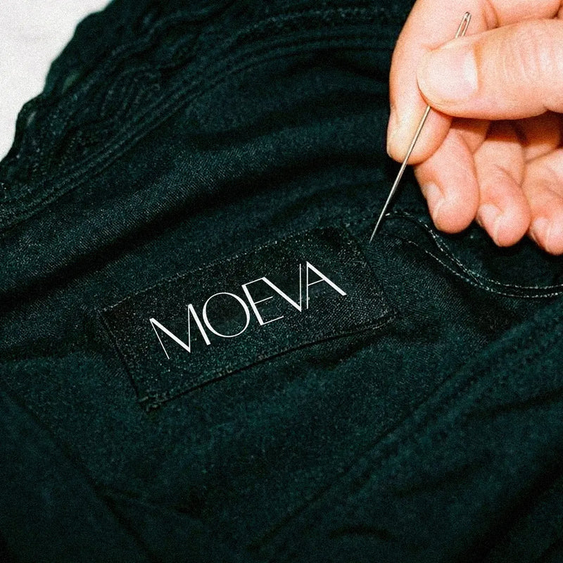 Moeva handcrafted swimwear detail featuring bespoke metal accessories, refined artisanal techniques, and precision finishing for a luxury, design-focused aesthetic