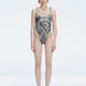 Front view of model wearing Calista Black Optical Swimsuit with scoop neck and two-layered tulle design.
