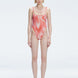 Front view of model wearing Calista Red Optical Swimsuit with scoop neck and two-layered tulle design.
