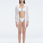 Front view of model wearing Chantel White Mesh Knit Kaftan with self-tie belt and long sleeves.
