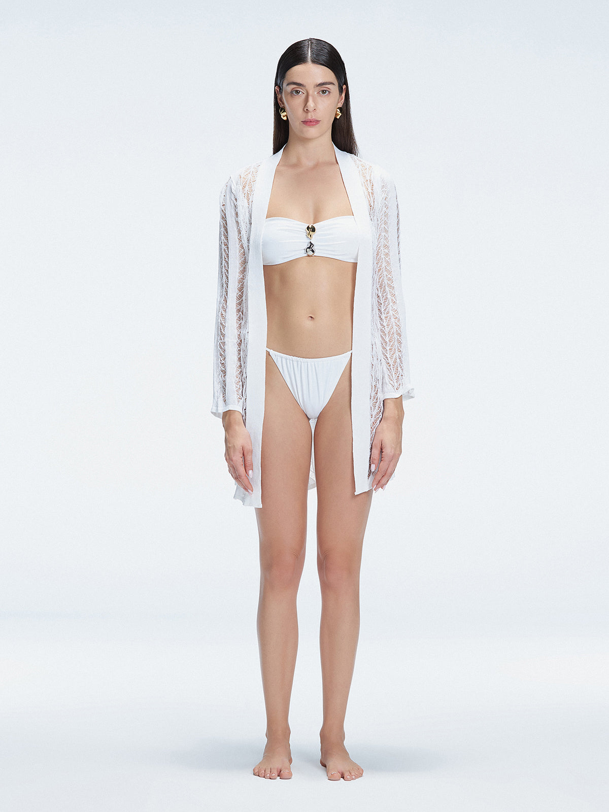 Front view of model wearing Chantel White Mesh Knit Kaftan with self-tie belt and long sleeves.
