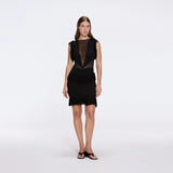 Diani Black Fringe Detail Sheer Panel Open Back Mini Dress | Moeva | RTW Dresses | Each week unveils new pieces—luxury swimwear, fluid resort silhouettes, and elevated summer-to-evening essentials designed to carry you from coastal escapes to city nights.