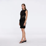 Diani Black Fringe Detail Sheer Panel Open Back Mini Dress | Moeva | RTW Dresses | Each week unveils new pieces—luxury swimwear, fluid resort silhouettes, and elevated summer-to-evening essentials designed to carry you from coastal escapes to city nights.