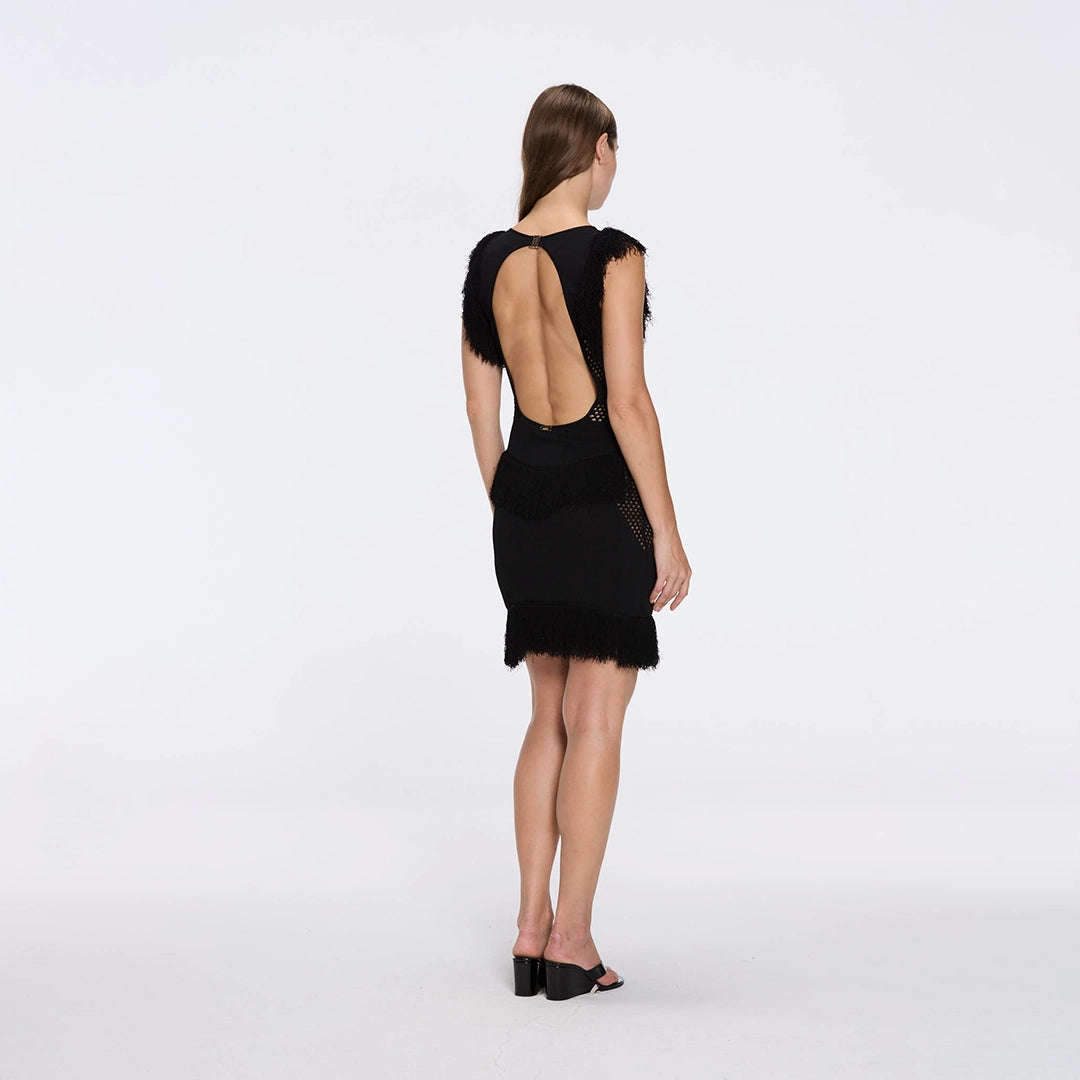 Diani Black Fringe Detail Sheer Panel Open Back Mini Dress | Moeva | RTW Dresses | Each week unveils new pieces—luxury swimwear, fluid resort silhouettes, and elevated summer-to-evening essentials designed to carry you from coastal escapes to city nights.