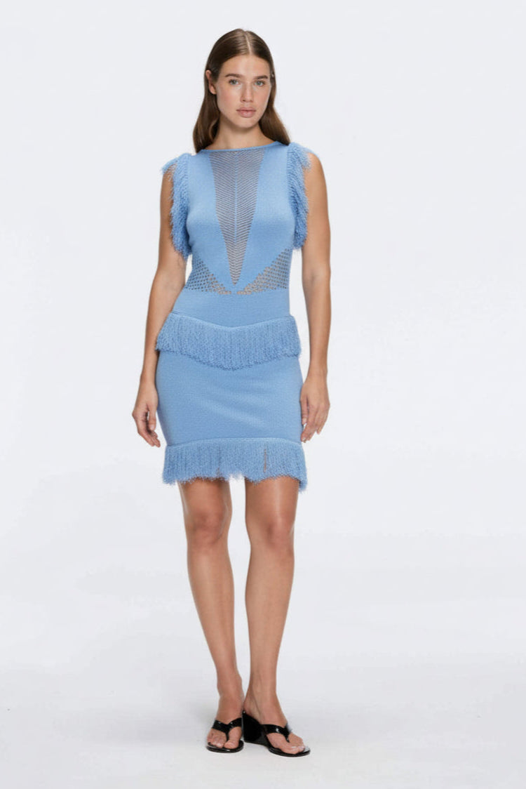 Diani Baby Blue Fringe Detail Sheer Panel Open Back Mini Dress | Moeva | RTW Dresses | Each week unveils new pieces—luxury swimwear, fluid resort silhouettes, and elevated summer-to-evening essentials designed to carry you from coastal escapes to city nights.