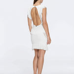 Diani White Fringe Detail Sheer Panel Open Back Mini Dress | Moeva | RTW Dresses | Each week unveils new pieces—luxury swimwear, fluid resort silhouettes, and elevated summer-to-evening essentials designed to carry you from coastal escapes to city nights.