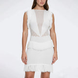 Diani White Fringe Detail Sheer Panel Open Back Mini Dress | Moeva | RTW Dresses | Each week unveils new pieces—luxury swimwear, fluid resort silhouettes, and elevated summer-to-evening essentials designed to carry you from coastal escapes to city nights.