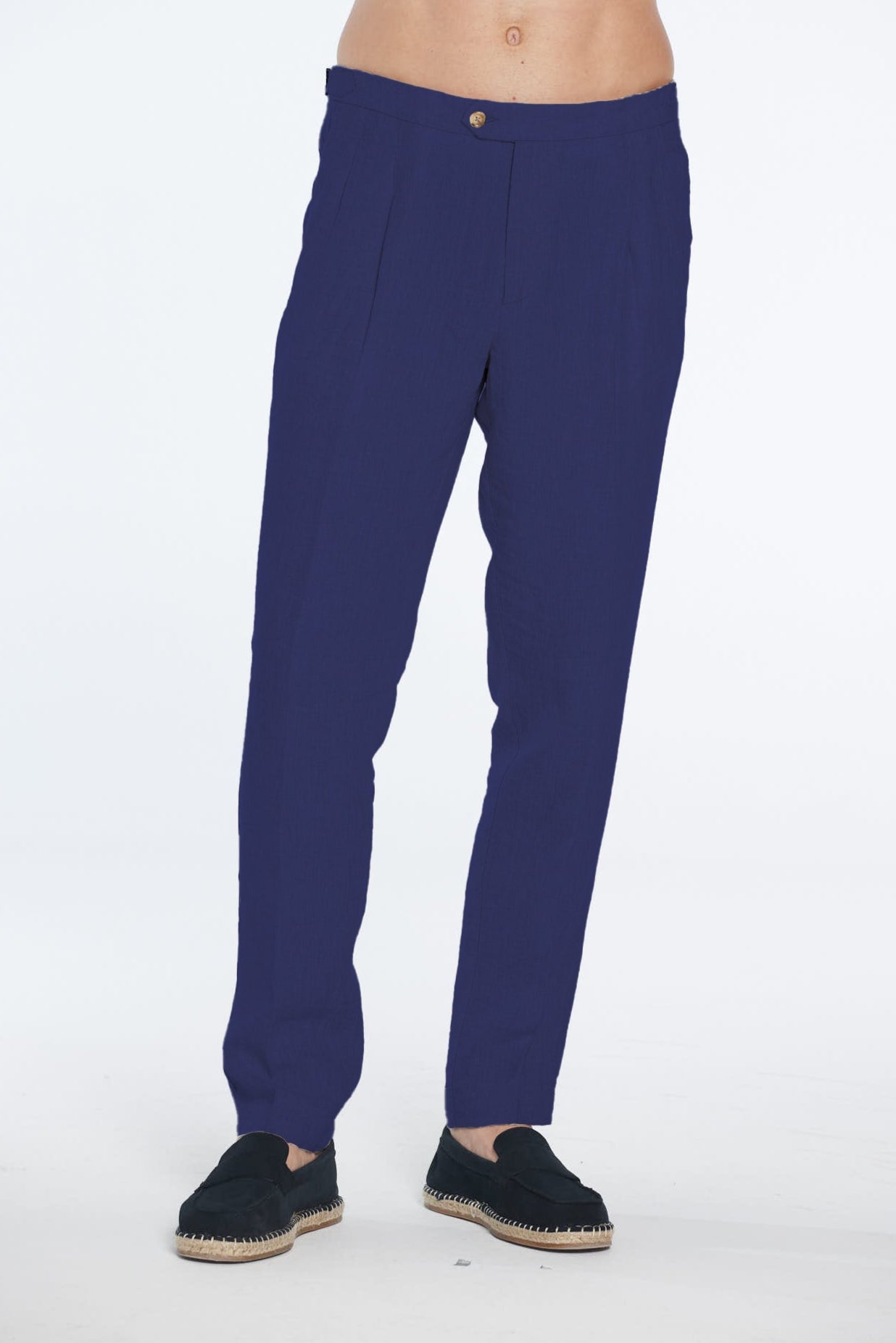 Navy blue pants worn by a person on a white background