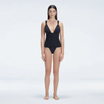 Griselda Black V-Neck Ruched Swimdress with Gold Detail | Moeva | One-Piece | Each week unveils new pieces—luxury swimwear, fluid resort silhouettes, and elevated summer-to-evening essentials designed to carry you from coastal escapes to city nights.