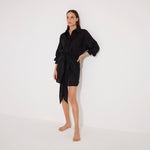 Guadalupe Black Linen Shirt Dress with Tie-Front Detail | Moeva | Beachwear Dresses | Each week unveils new pieces—luxury swimwear, fluid resort silhouettes, and elevated summer-to-evening essentials designed to carry you from coastal escapes to city nights.
