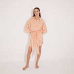 Guadalupe Orange Linen Shirt Dress with Tie-Front Detail | Moeva | Beachwear Dresses | Each week unveils new pieces—luxury swimwear, fluid resort silhouettes, and elevated summer-to-evening essentials designed to carry you from coastal escapes to city nights.
