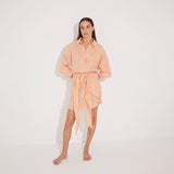 Guadalupe Orange Linen Shirt Dress with Tie-Front Detail | Moeva | Beachwear Dresses | Each week unveils new pieces—luxury swimwear, fluid resort silhouettes, and elevated summer-to-evening essentials designed to carry you from coastal escapes to city nights.