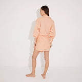 Guadalupe Orange Linen Shirt Dress with Tie-Front Detail | Moeva | Beachwear Dresses | Each week unveils new pieces—luxury swimwear, fluid resort silhouettes, and elevated summer-to-evening essentials designed to carry you from coastal escapes to city nights.