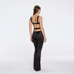 Gwyneth High-Waist with Gold Detail Satin Flare Black Pants | Moeva | Women Beachwear Pants | Each week unveils new pieces—luxury swimwear, fluid resort silhouettes, and elevated summer-to-evening essentials designed to carry you from coastal escapes to city nights.