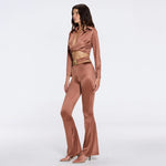 Gwyneth High-Waist with Gold Detail Satin Flare Brown Pants | Moeva | Women Beachwear Pants | Each week unveils new pieces—luxury swimwear, fluid resort silhouettes, and elevated summer-to-evening essentials designed to carry you from coastal escapes to city nights.