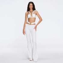 Gwyneth High-Waist with Gold Detail Satin Flare White Pants | Moeva | Women Beachwear Pants | Each week unveils new pieces—luxury swimwear, fluid resort silhouettes, and elevated summer-to-evening essentials designed to carry you from coastal escapes to city nights.