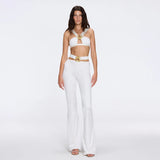 Gwyneth High-Waist with Gold Detail Satin Flare White Pants | Moeva | Women Beachwear Pants | Each week unveils new pieces—luxury swimwear, fluid resort silhouettes, and elevated summer-to-evening essentials designed to carry you from coastal escapes to city nights.