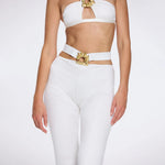 Gwyneth High-Waist with Gold Detail Satin Flare White Pants | Moeva | Women Beachwear Pants | Each week unveils new pieces—luxury swimwear, fluid resort silhouettes, and elevated summer-to-evening essentials designed to carry you from coastal escapes to city nights.