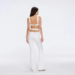 Gwyneth High-Waist with Gold Detail Satin Flare White Pants | Moeva | Women Beachwear Pants | Each week unveils new pieces—luxury swimwear, fluid resort silhouettes, and elevated summer-to-evening essentials designed to carry you from coastal escapes to city nights.