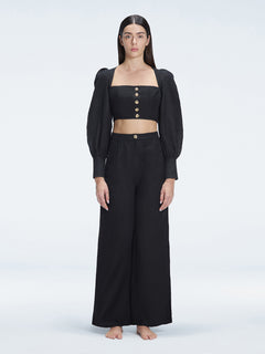 Front view of model wearing Gemma Black Cropped Top and Valencia Black Pants with blouson sleeves and sleek silhouette.
