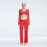 Helena Straight Leg Accessorised Red Pants | Moeva | Pants | Each week unveils new pieces—luxury swimwear, fluid resort silhouettes, and elevated summer-to-evening essentials designed to carry you from coastal escapes to city nights.