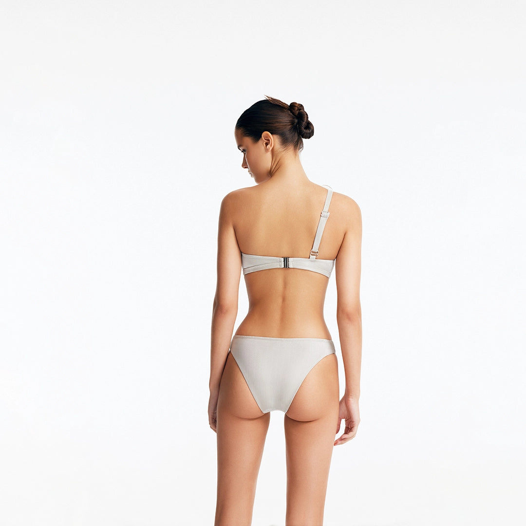 Calix Silver One Shoulder Mid Coverage Bikini Set | Moeva | Bikini Set | Each week unveils new pieces—luxury swimwear, fluid resort silhouettes, and elevated summer-to-evening essentials designed to carry you from coastal escapes to city nights.