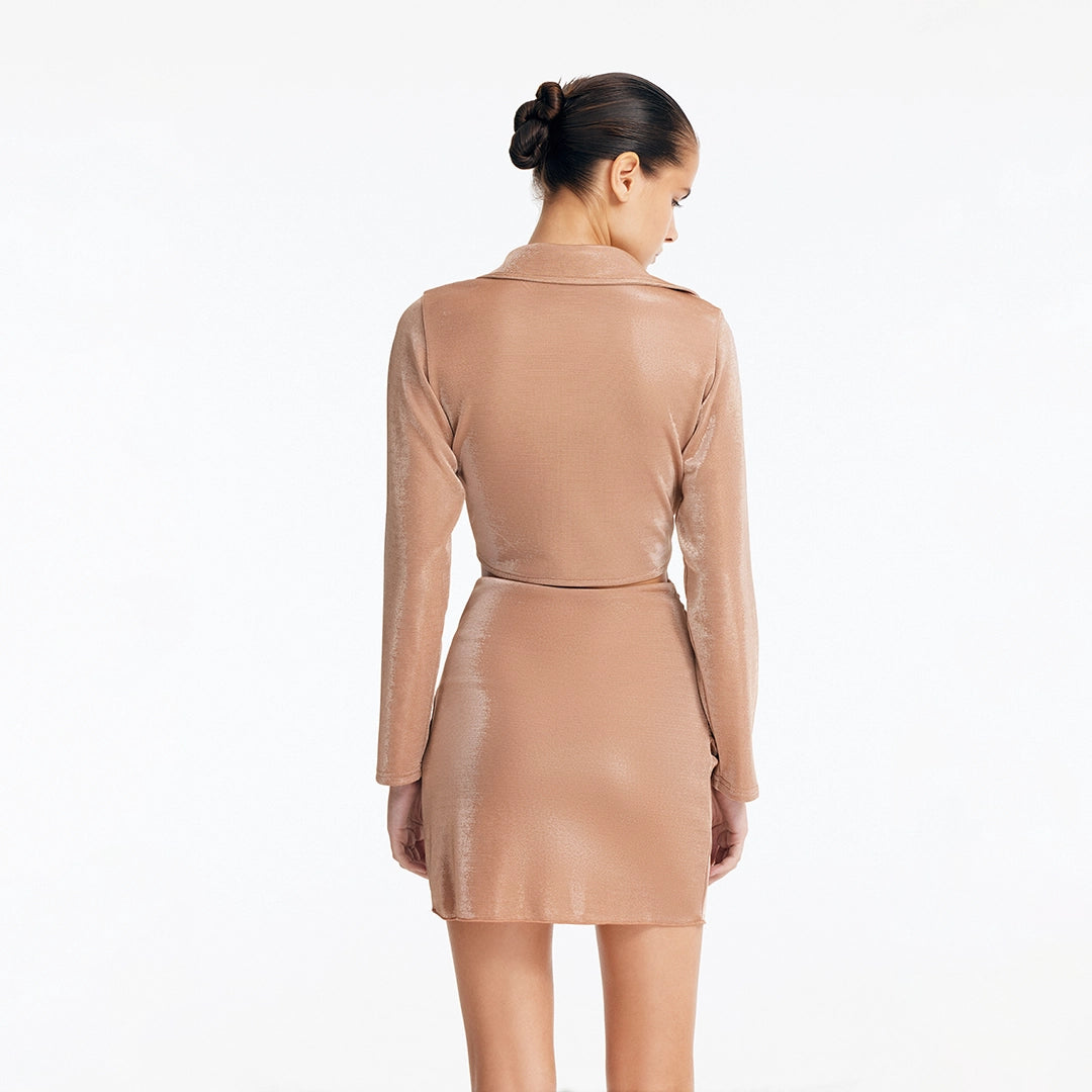 Greta Bronze Long Sleeve Tie Front Shirt and Indigo Asymmetric Ring-Drape Mini Skirt | Moeva | Set | Each week unveils new pieces—luxury swimwear, fluid resort silhouettes, and elevated summer-to-evening essentials designed to carry you from coastal escapes to city nights.