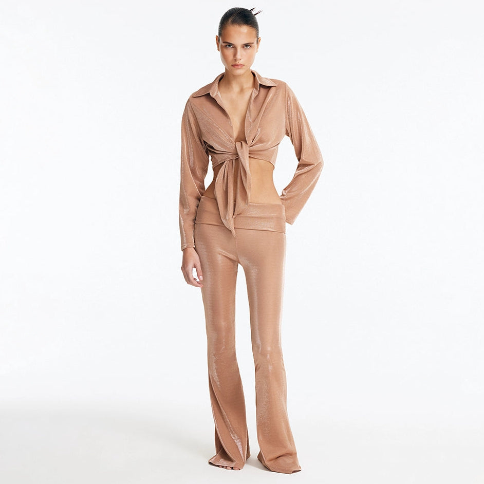 Greta Bronze Long Sleeve Tie Front Shirt and Izara Mid-Rise Flared Pants | Moeva | Set | Each week unveils new pieces—luxury swimwear, fluid resort silhouettes, and elevated summer-to-evening essentials designed to carry you from coastal escapes to city nights.
