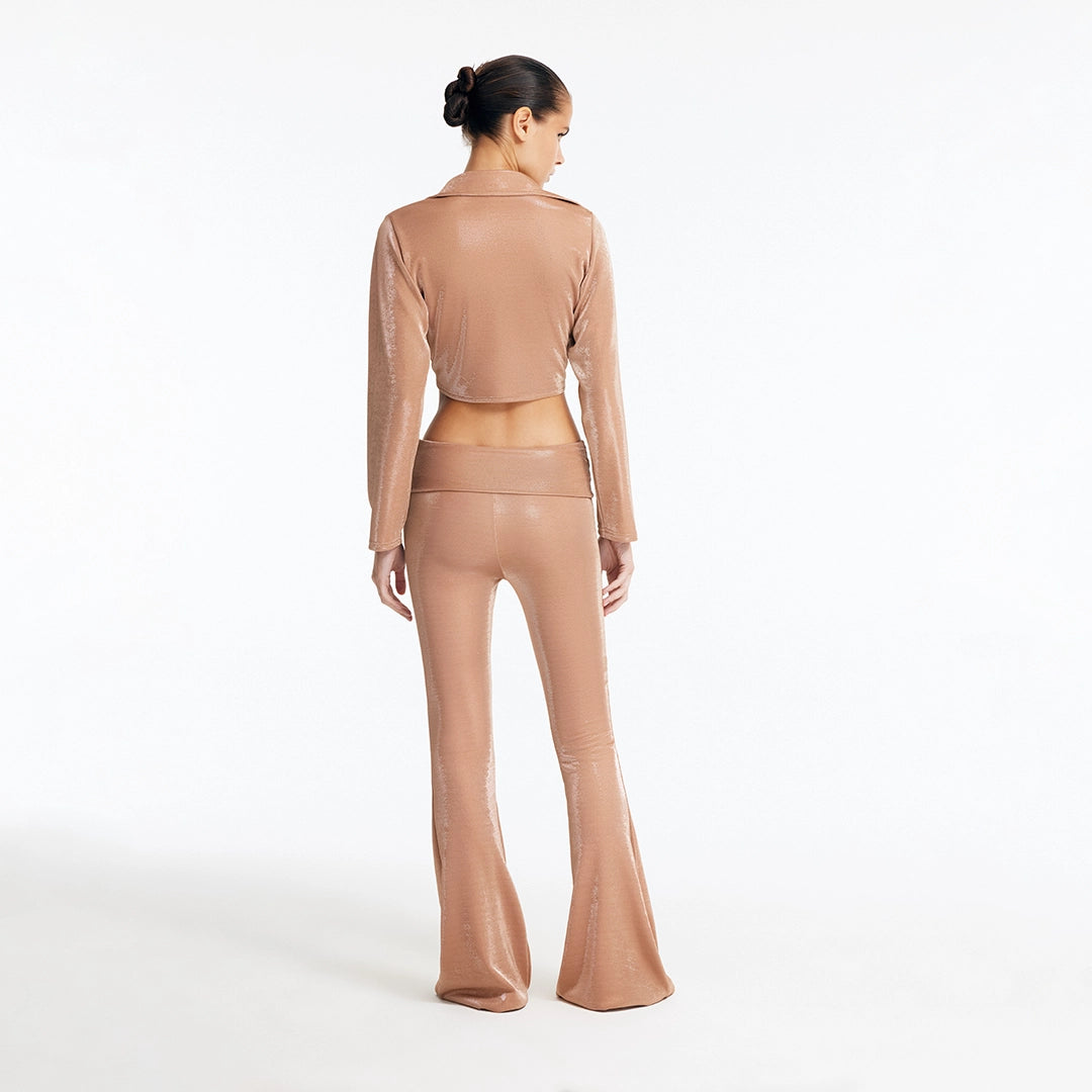 Greta Bronze Long Sleeve Tie Front Shirt and Izara Mid-Rise Flared Pants | Moeva | Set | Each week unveils new pieces—luxury swimwear, fluid resort silhouettes, and elevated summer-to-evening essentials designed to carry you from coastal escapes to city nights.