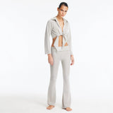 Izara Silver Mid-Rise Flared Pants | Moeva | Pants | Each week unveils new pieces—luxury swimwear, fluid resort silhouettes, and elevated summer-to-evening essentials designed to carry you from coastal escapes to city nights.