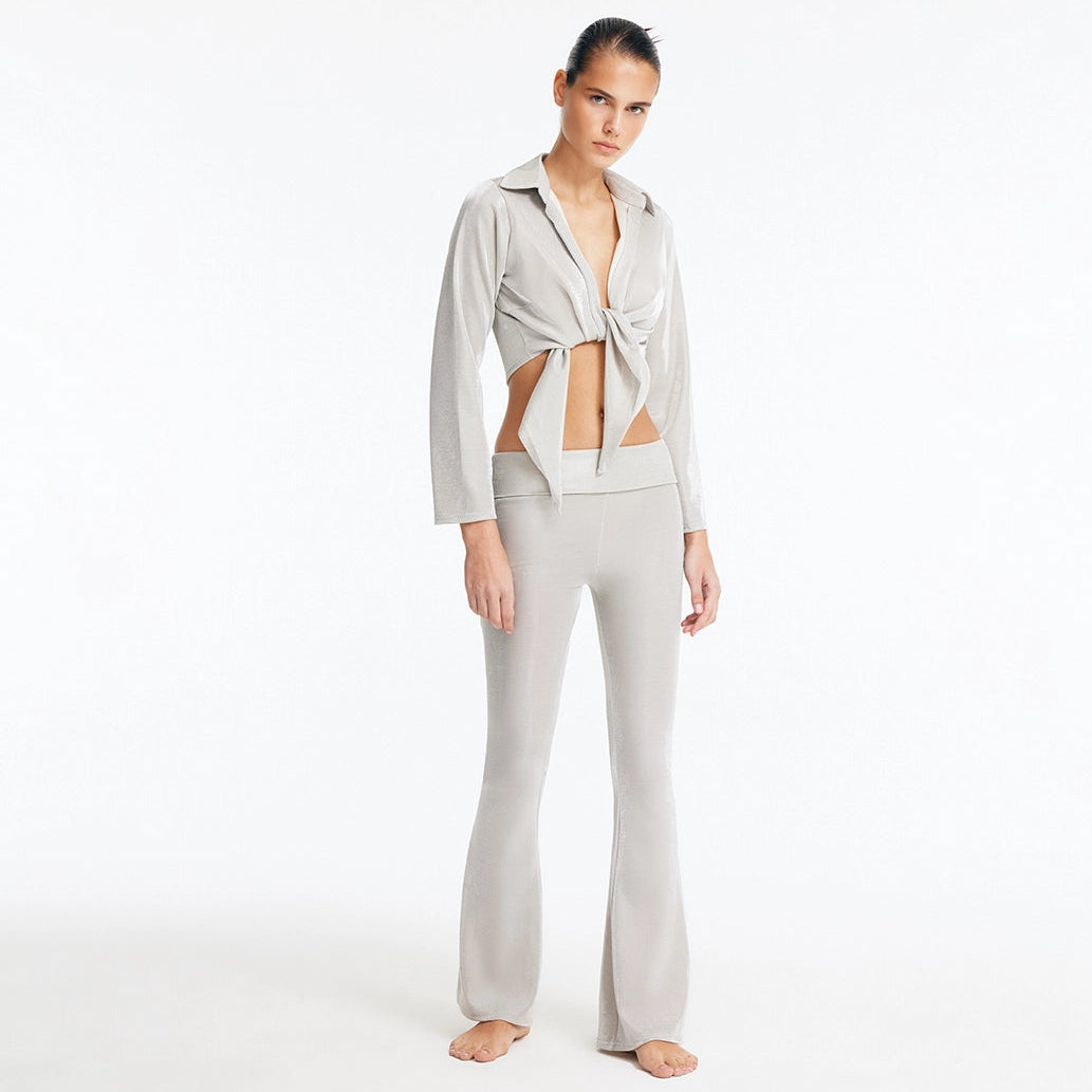 Greta Silver Long Sleeve Tie Front Shirt and Izara Mid-Rise Flared Pants | Moeva | Set | Each week unveils new pieces—luxury swimwear, fluid resort silhouettes, and elevated summer-to-evening essentials designed to carry you from coastal escapes to city nights.
