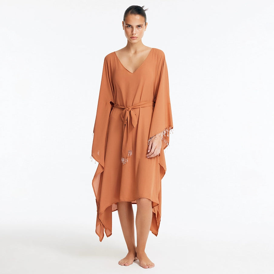 Bethany Bronze V Neck Belted Silk Kaftan | Moeva | Kaftan | Each week unveils new pieces—luxury swimwear, fluid resort silhouettes, and elevated summer-to-evening essentials designed to carry you from coastal escapes to city nights.