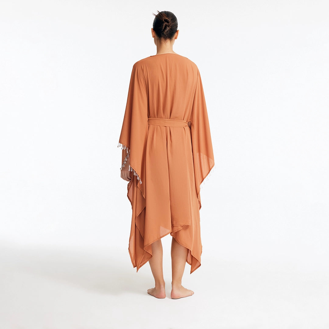 Bethany Bronze V Neck Belted Silk Kaftan | Moeva | Kaftan | Each week unveils new pieces—luxury swimwear, fluid resort silhouettes, and elevated summer-to-evening essentials designed to carry you from coastal escapes to city nights.