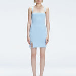 Front view of model wearing Heather Baby Blue Mini Dress with square neckline, adjustable straps, and front slit.
