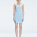 Front view of model wearing Heather Baby Blue Mini Dress with square neckline, adjustable straps, and front slit.
